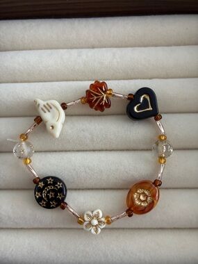 Multicolor Glass Bead Charm Bracelet with Heart and Floral Accents